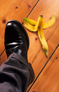 businessman-about-to-step-on-banana-skin