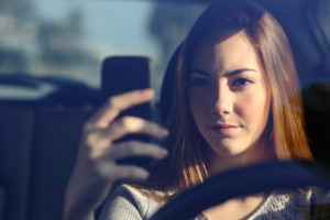 woman-using-phone-in-car